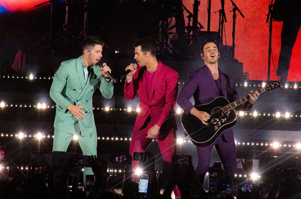 Watch the Jonas Brothers Share Sweet Midnight Kisses With Their Wives