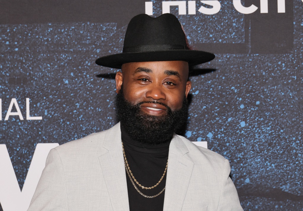 Tray Chaney Wearing Blazer And Hat