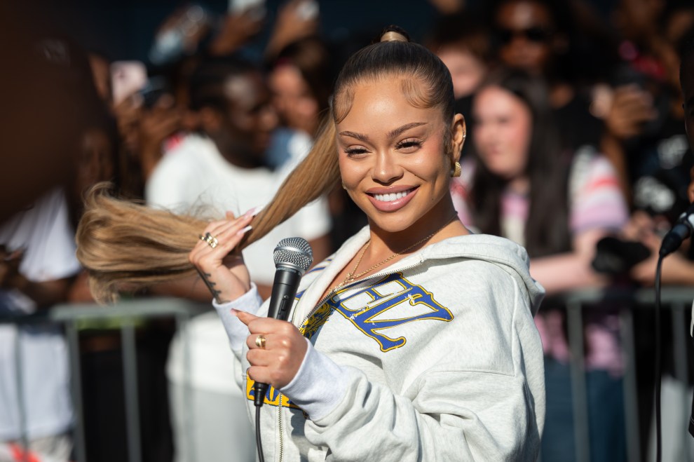 LONDON, ENGLAND - JUNE 16: Latto performs on TikTok LIVE with DJ AG ONLINE outside Kings Cross station on June 16, 2025 in London, England.